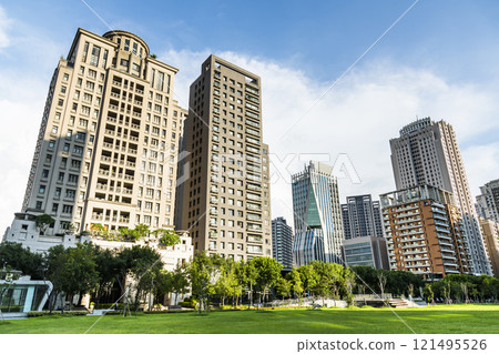 View of the park and surrounding modern buildings in front of Taichung City Council, Taiwan. 121495526