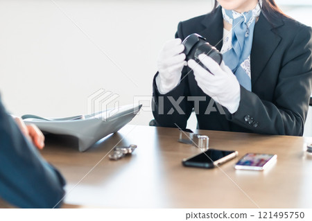 A specialist purchasing company assessing lenses (no face) A specialist purchasing company assessing lenses (no face) 121495750