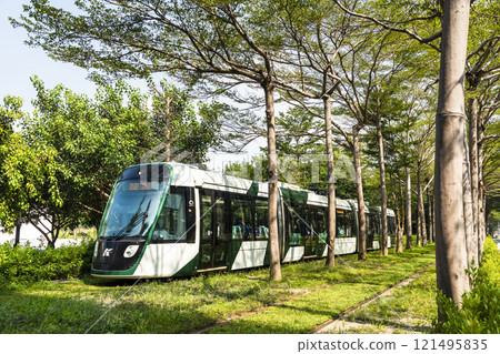 The circular light rail train drives past the Kaohsiung Museum of Fine Arts station in Taiwan. The circular light rail train drives past the Kaohsiung Museum of Fine Arts station in Taiwan. 121495835