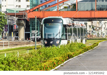 The circular light rail train drives past Hamasen Railway Cultural Park in Kaohsiung, Taiwan. The circular light rail train drives past Hamasen Railway Cultural Park in Kaohsiung, Taiwan. 121495842