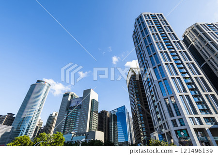 Low-angle view of New Taipei City Government building and other modern buildings in Banqiao, Taiwan. Low-angle view of New Taipei City Government building and other modern buildings in Banqiao, Taiwan. 121496139