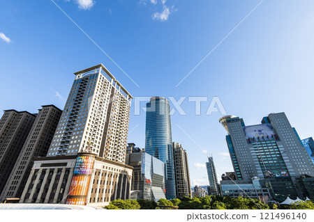 Low-angle view of New Taipei City Government building and other modern buildings in Banqiao, Taiwan. 121496140