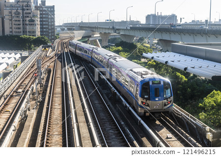 View of a Taoyuan International Airport line train running on the elevated track of the Taoyuan Mass Rapid Transit System. 121496215