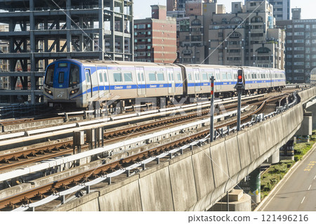 View of a Taoyuan International Airport line train running on the elevated track of the Taoyuan Mass Rapid Transit System. 121496216