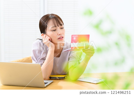 Woman, middle-aged, bankbook, worries Woman, middle-aged, bankbook, worries 121496251