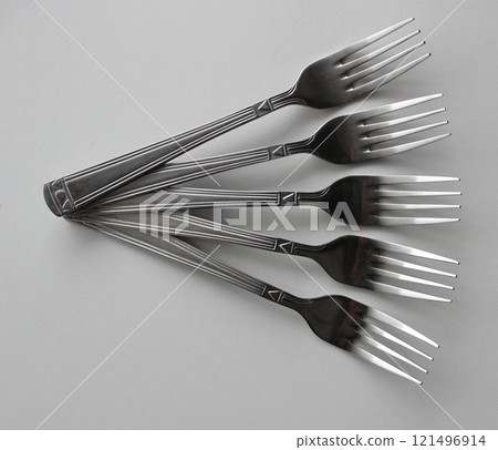 Same Table Forks Laid Out In A Fan Shape Isolated On White Same Table Forks Laid Out In A Fan Shape Isolated On White 121496914