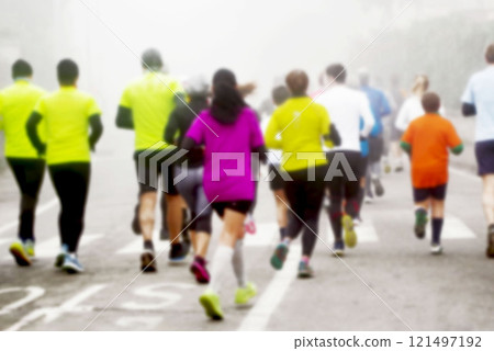 City marathon in northern Italy shrouded in fog Marathon runners colorful City marathon in northern Italy shrouded in fog Marathon runners colorful 121497192