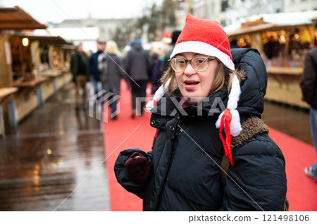 42 yo Down Syndrome woman at the Christmas market in Brussels, Belgium 121498106