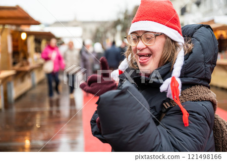 42 yo Down Syndrome woman at the Christmas market in Brussels, Belgium 121498166