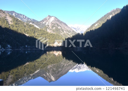 landscape of mirror lake at Jiuzhaigou natural national park travel location in China landscape of mirror lake at Jiuzhaigou natural national park travel location in China 121498741