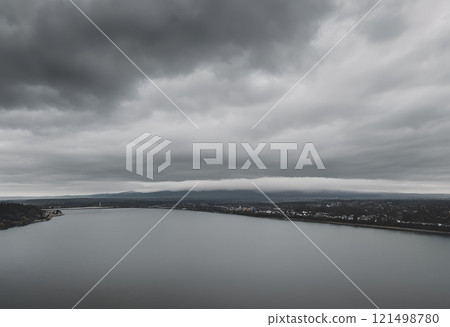 river view stretching far with thick clouds overhead.AI Generated river view stretching far with thick clouds overhead.AI Generated 121498780