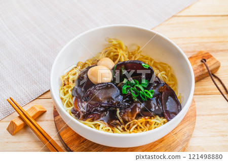 Fried noodles with thickened sauce and wood ear mushrooms and quail Fried noodles with thickened sauce and wood ear mushrooms and quail 121498880