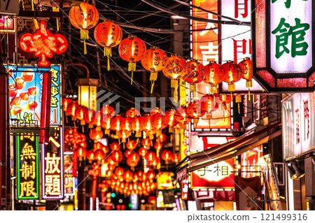 Yokohama cityscape in Japan, end of the year. Night view of Yokohama Chinatown and Ichiba Street. Vibrant red lanterns welcome tourists. Yokohama cityscape in Japan, end of the year. Night view of Yokohama Chinatown and Ichiba Street. Vibrant red lanterns welcome tourists. 121499316