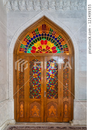 Exploration of an intricate stained glass wooden door at Bibi-Heybat Mosque in Baku, Azerbaijan 121499355