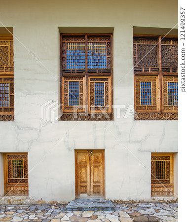 Shakikhanovs Palace showcases intricate wooden architecture in Shaki Azerbaijan during a bright sunny day 121499357