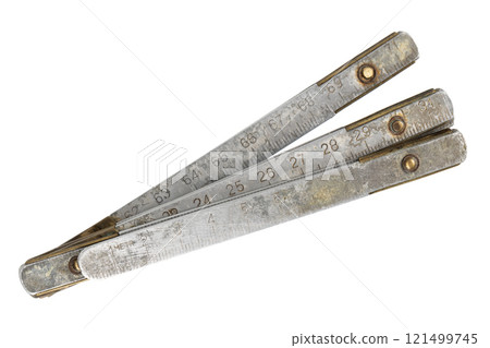 Antique carpenter's brass ruler isolated on white. 121499745