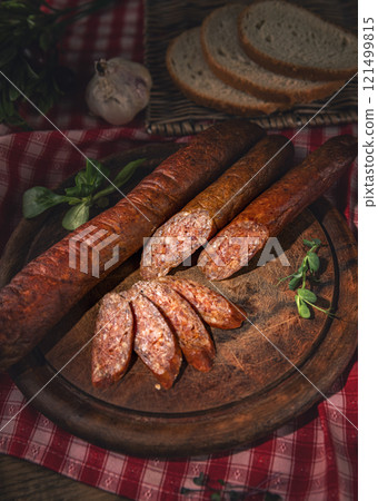 Traditional homemade sausages seasoned with herbs Traditional homemade sausages seasoned with herbs 121499815