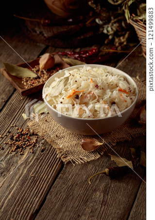 Traditional German sauerkraut on a old rustic wooden table. 121499883