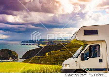 Camper car on sea coast in Asturias Spain. Camper car on sea coast in Asturias Spain. 121499935