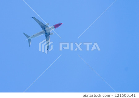 Airplane in the blue sky 121500141
