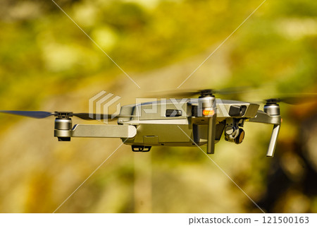 Drone flying against nature 121500163
