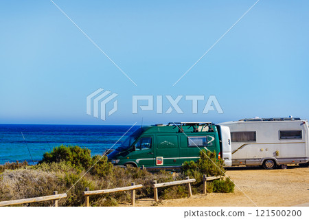 Camper car on beach, camping on seashore Camper car on beach, camping on seashore 121500200