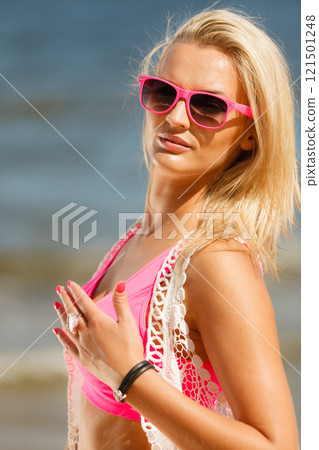 Pretty girl on beach. 121501248