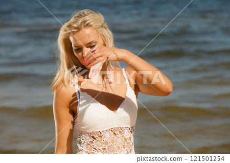 Pretty girl on beach. 121501254