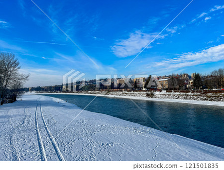 Panoramic winter landscape view with the blue sky on the banks of the San river at Przemysl, Poland  121501835
