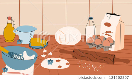 A kitchen table with baking ingredients. Home-made cookies, bread and cakes. 121502207