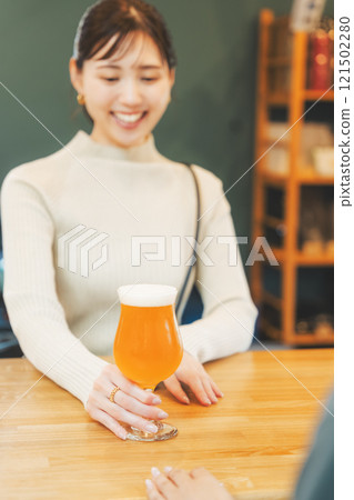 A young woman enjoying craft beer. Photo courtesy of Tsukioka Brewery. A young woman enjoying craft beer. Photo courtesy of Tsukioka Brewery. 121502280