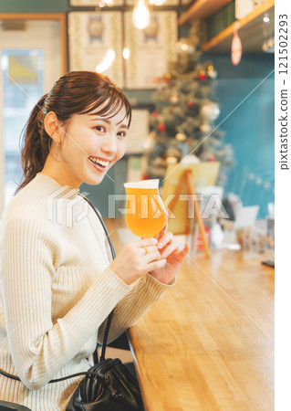 A young woman enjoying craft beer. Photo courtesy of Tsukioka Brewery. A young woman enjoying craft beer. Photo courtesy of Tsukioka Brewery. 121502293