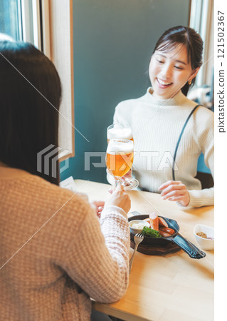 Two young women toasting with beer. Photo courtesy of Tsukioka Brewery. Two young women toasting with beer. Photo courtesy of Tsukioka Brewery. 121502367