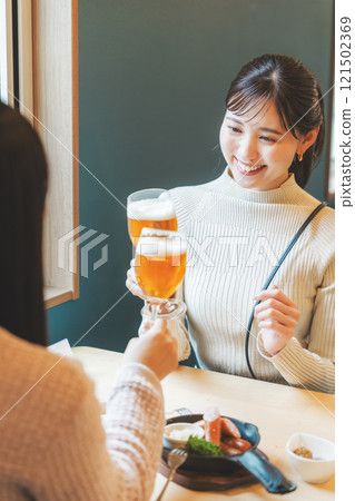 Two young women toasting with beer. Photo courtesy of Tsukioka Brewery. Two young women toasting with beer. Photo courtesy of Tsukioka Brewery. 121502369