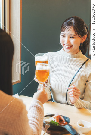 Two young women toasting with beer. Photo courtesy of Tsukioka Brewery. Two young women toasting with beer. Photo courtesy of Tsukioka Brewery. 121502370