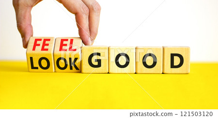 Look and feel good symbol. Concept words Look good Feel good on wooden cubes. Beautiful yellow table white background. Doctor hand. Healthy lifestyle look and feel good concept. Copy space. Look and feel good symbol. Concept words Look good Feel good on wooden cubes. Beautiful yellow table white background. Doctor hand. Healthy lifestyle look and feel good concept. Copy space. 121503120