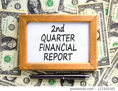 2nd quarter financial report symbol. Concept words 2nd quarter financial report on beautiful wooden frame. Beautiful dollar background. Business 2nd quarter financial report concept. Copy space. 2nd quarter financial report symbol. Concept words 2nd quarter financial report on beautiful wooden frame. Beautiful dollar background. Business 2nd quarter financial report concept. Copy space. 121503165