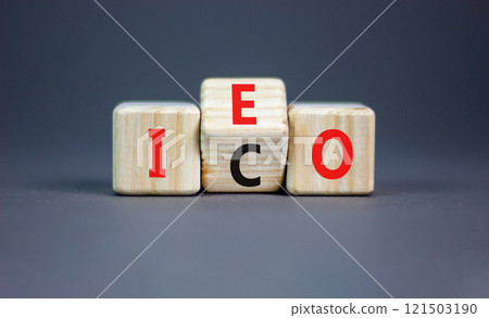 Initial coin or exchange offering symbol. Concept words abbreviation ICO or IEO on wooden block. Beautiful grey table grey background. Business Initial coin or exchange offering concept. Copy space. 121503190