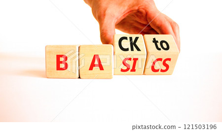 Back to basics symbol. Concept words Back to basics on wooden block. Beautiful white table white background. Businessman hand. Business back to basics concept. Copy space. 121503196