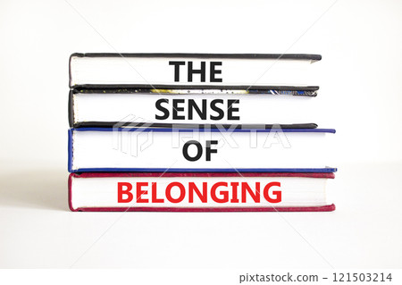 The sense of belonging symbol. Concept words The sense of belonging on beautiful books. Beautiful white table white background. Business and the sense of belonging concept. Copy space. 121503214