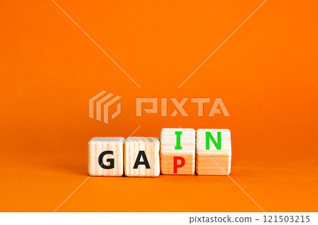 Gain or gap symbol. Concept words Gain Gap on wooden block. Beautiful orange table orange background. Business gain or gap concept. Copy space. 121503215