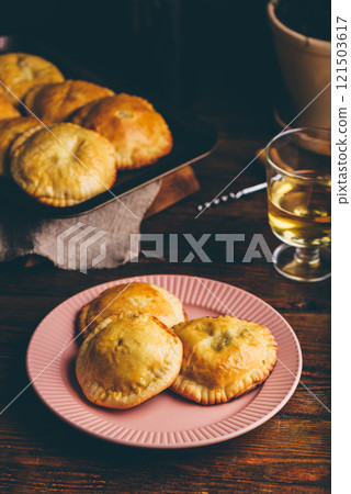 Freshly Baked Pastries with Blue Chives and Mushrooms on Plate Freshly Baked Pastries with Blue Chives and Mushrooms on Plate 121503617