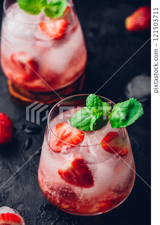 Cocktail with strawberry, vodka and tonic Cocktail with strawberry, vodka and tonic 121503711