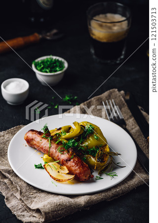Baked pork sausage with green bell peppers, onion and herbs Baked pork sausage with green bell peppers, onion and herbs 121503713