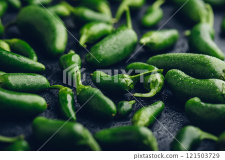 Ripe Jalapeno Peppers on Concrete Backdrop 121503729