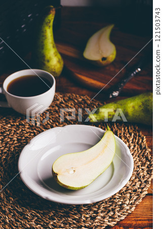 Half of Green Pear on White Plate Half of Green Pear on White Plate 121503743