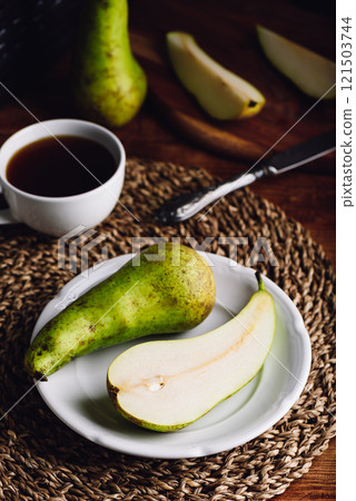Halved Conference Pear on Plate and Cup of Coffee Halved Conference Pear on Plate and Cup of Coffee 121503744