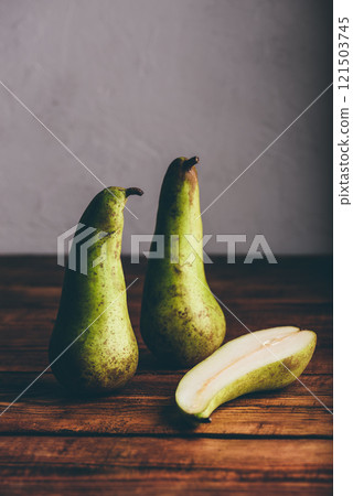 Green Pears on Wooden Table 121503745