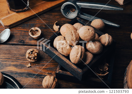 Walnuts in small wooden box Walnuts in small wooden box 121503793