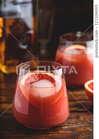 Whiskey sour cocktail with blood orange juice Whiskey sour cocktail with blood orange juice 121504005